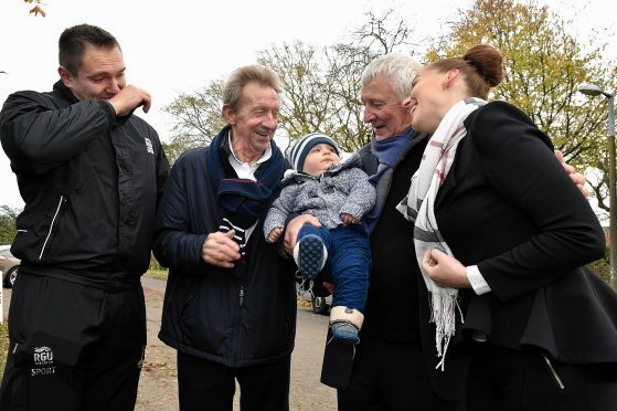 Denis Law with former team mate Mike Summerbee (right) and Tony Petrov (left) with Tony's son Alexander and mum Mihaela Micheva. Picture by Colin Rennie