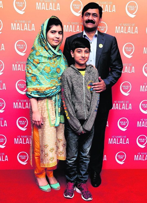 Malala, her father Ziauddin and brother Atal Khan