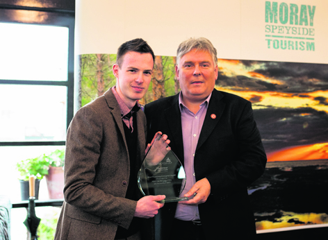 Darren Margach, left, from Pinz Bowling Ltd, receiving the Most Promising Enterprise Award from Craig Robertson, of Business Gateway