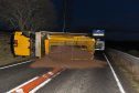 An overturned gritter on the A95
