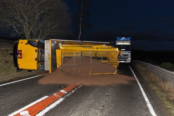 An overturned gritter on the A95