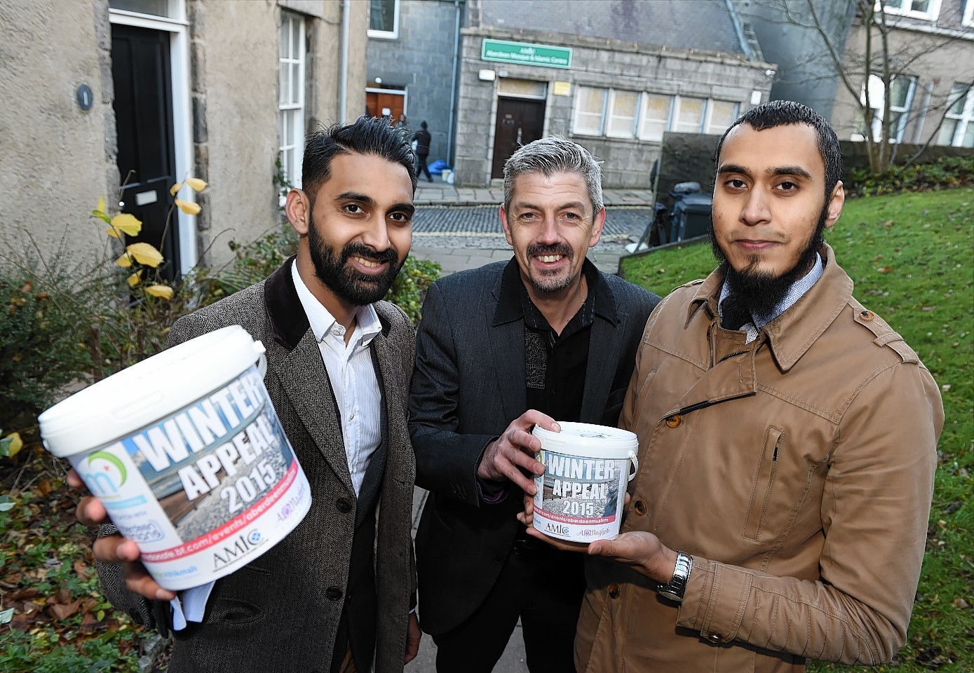 Sumon Hoque (left) and Mamun Razzak with Scott Baxter, Deputy Chief Executive for Aberdeen Cyrenians, launching the Aberdeen Muslims Winter Appeal