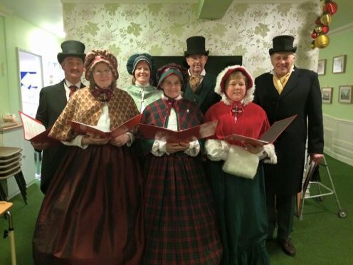 Buchanhaven Heritage Society in Peterhead donned some Charles Dickens-inspired garb to spread holiday joy around the town.