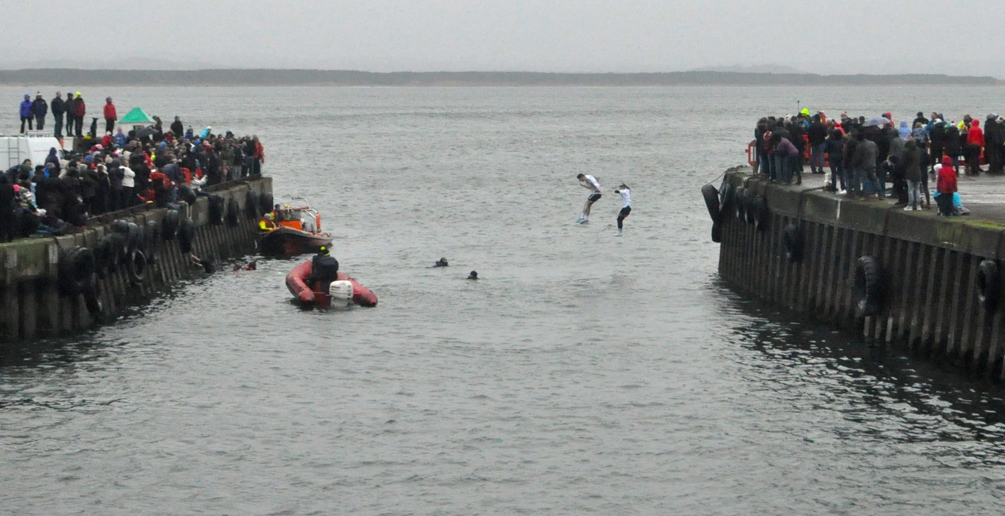 Burghead swimmers jump into the harbour
