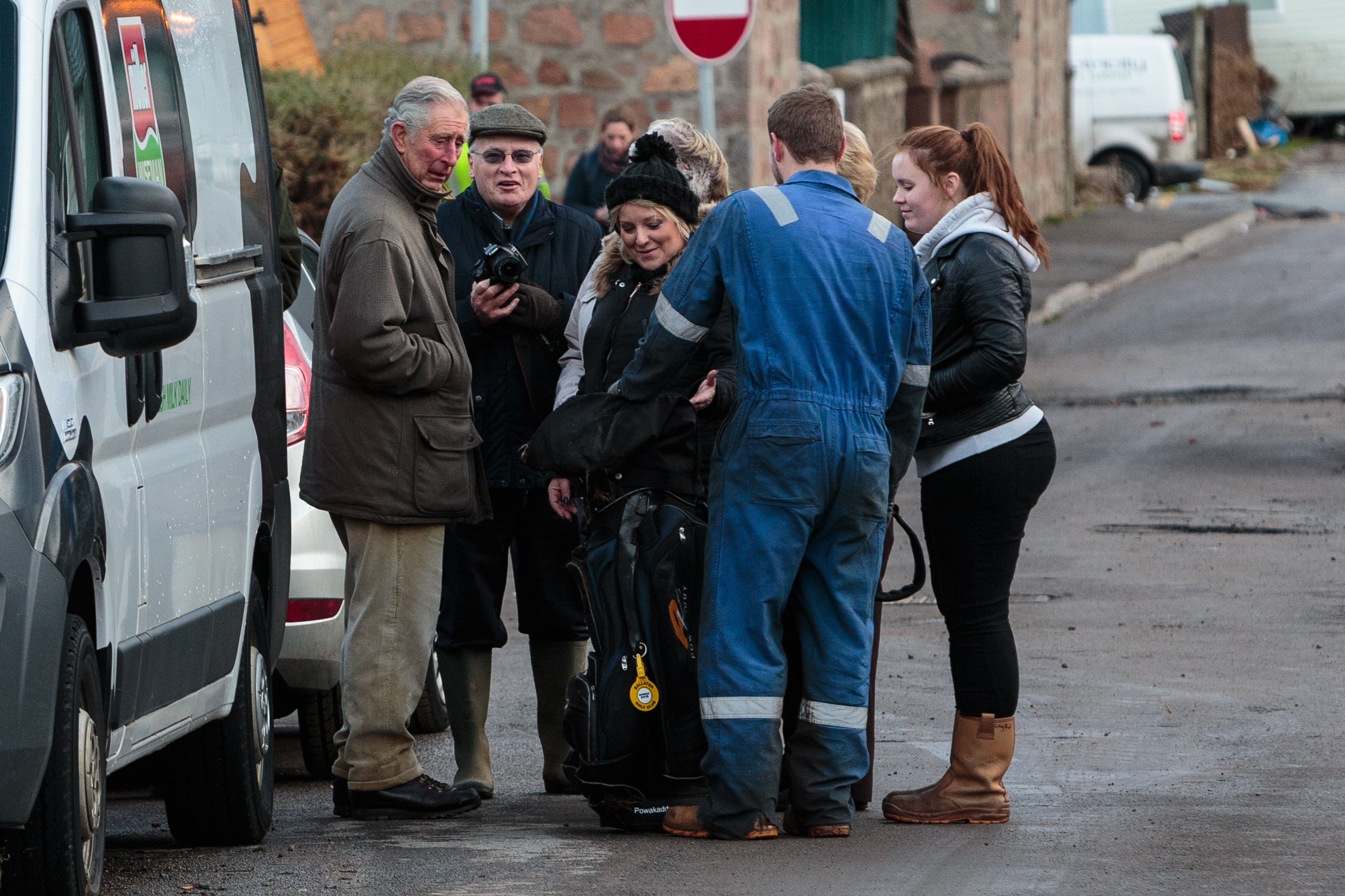 Thursday 31st December 2015, Aberdeen, Scotland. The aftermath of Storm Frank is revealed as residents of Ballater begin the clear up on New Years Eve Pictured: Prince Charles speaks to residents in Ballater amongst the devistation in the wake of Storm Frank (Photo: Ross Johnston/Newsline Media)