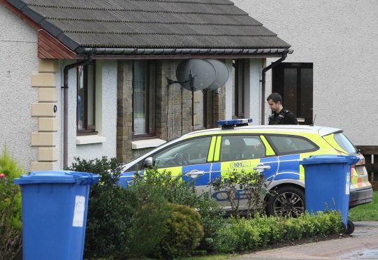 Police on the scene at Coiltie Crescent. Picture: Andrew Smith