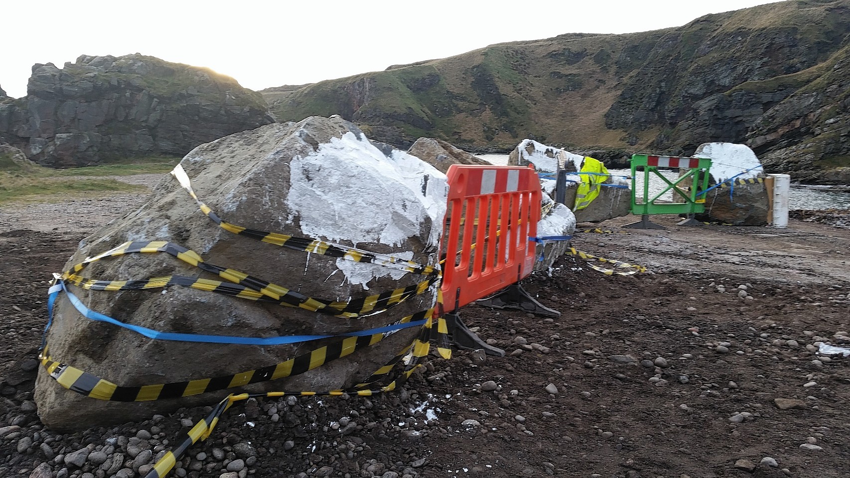 Large boulders and smaller stones arrive at Cove Harbour to prevent access. Picture by Colin Rennie 