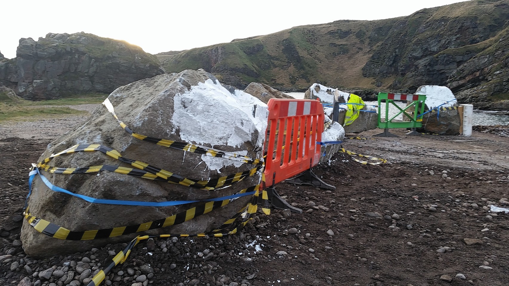 Large boulders and smaller stones arrive at Cove  Harbour to prevent access. Picture by Colin Rennie 