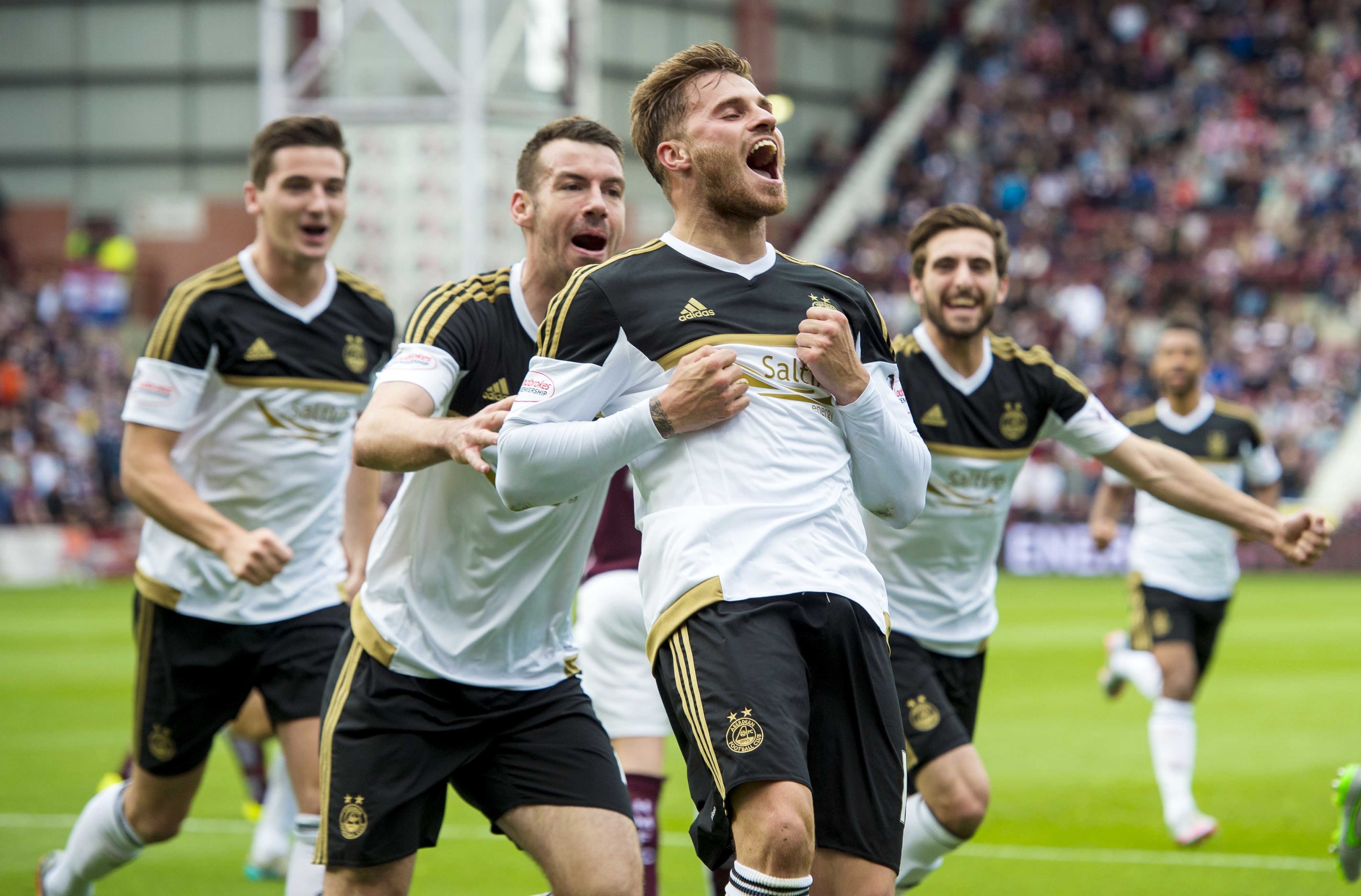 David Goodwillie celebrates netting for the Dons against Hearts earlier this season