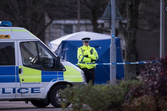 Police guard the scene on Foresterhill Road