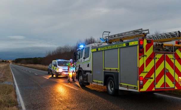 Emergency services on the scene of the crash on the A941