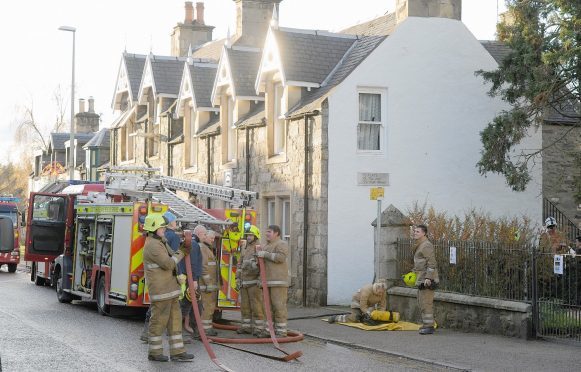Firefighters at the scene of the incident in Grantown