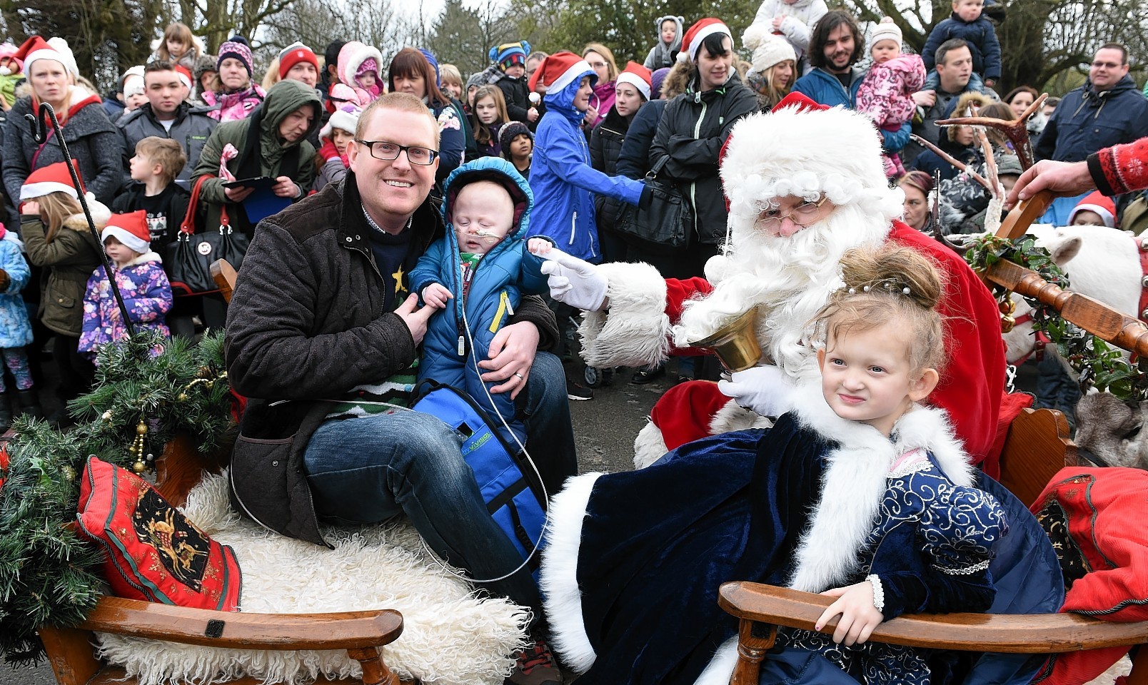 The Winter Wonderland event at Hazlehead park, Aberdeen. In the picture are santa, Kariss Bell, 5 Bruce and Jack Edmond, 8 mts.
Picture by Jim Irvine  20-12-15