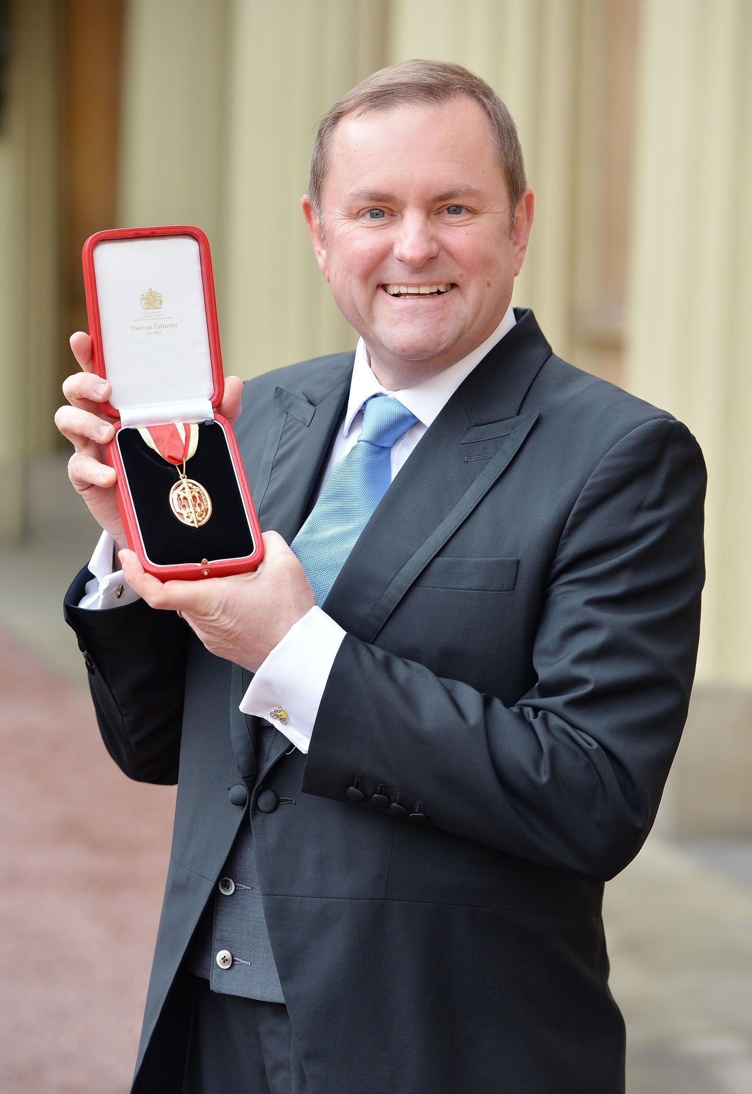 Sir Gary Verity holds his insignia of Knighthood which was presented by the Prince of Wales at the Investiture ceremony in Buckingham Palace, London. 