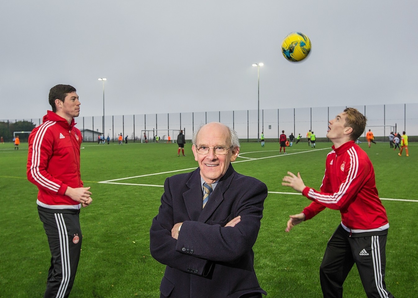 Dr George Stevenson with Aberdeen FC's Scott McKenna (left) and Scott Wright