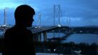 First Minister Nicola Sturgeon looks out over the closed Forth Road Bridge