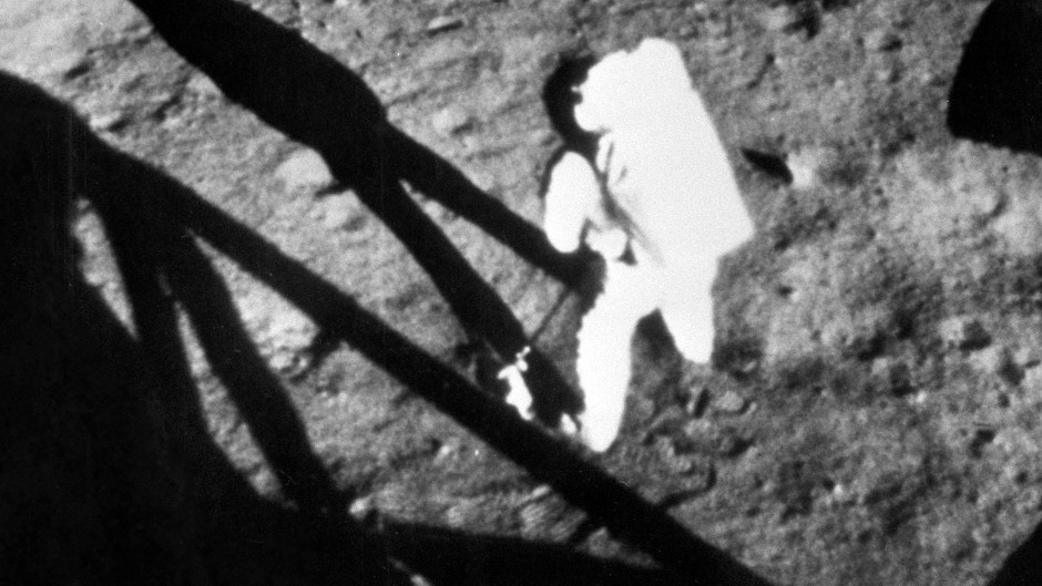 Neil Armstrong walking on the moon in 1969