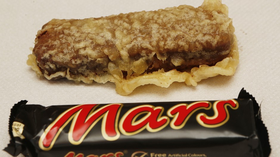 a deep-fried mars bar next to one in its wrapper.