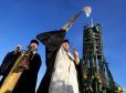 A Russian Orthodox priest blesses the media and well-wishers after a service at the Baikonur Cosmodrome in Kazakhstan to bless the Soyuz FG rocket which will carry British astronaut Tim Peake to the International Space Station tomorrow.