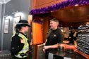 Pc Lindsey Dow and Murray Gordon, owner at Station Hotel, Stonehaven. Picture by Jim Irvine