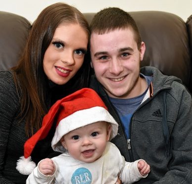 Ryan Taylor and partner Shannon Brown with their baby son