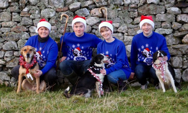 Joyce Campbell, Mure Grant, Frances Grant and Stephen Forbes with canine team members Jude, Sky and Meg.