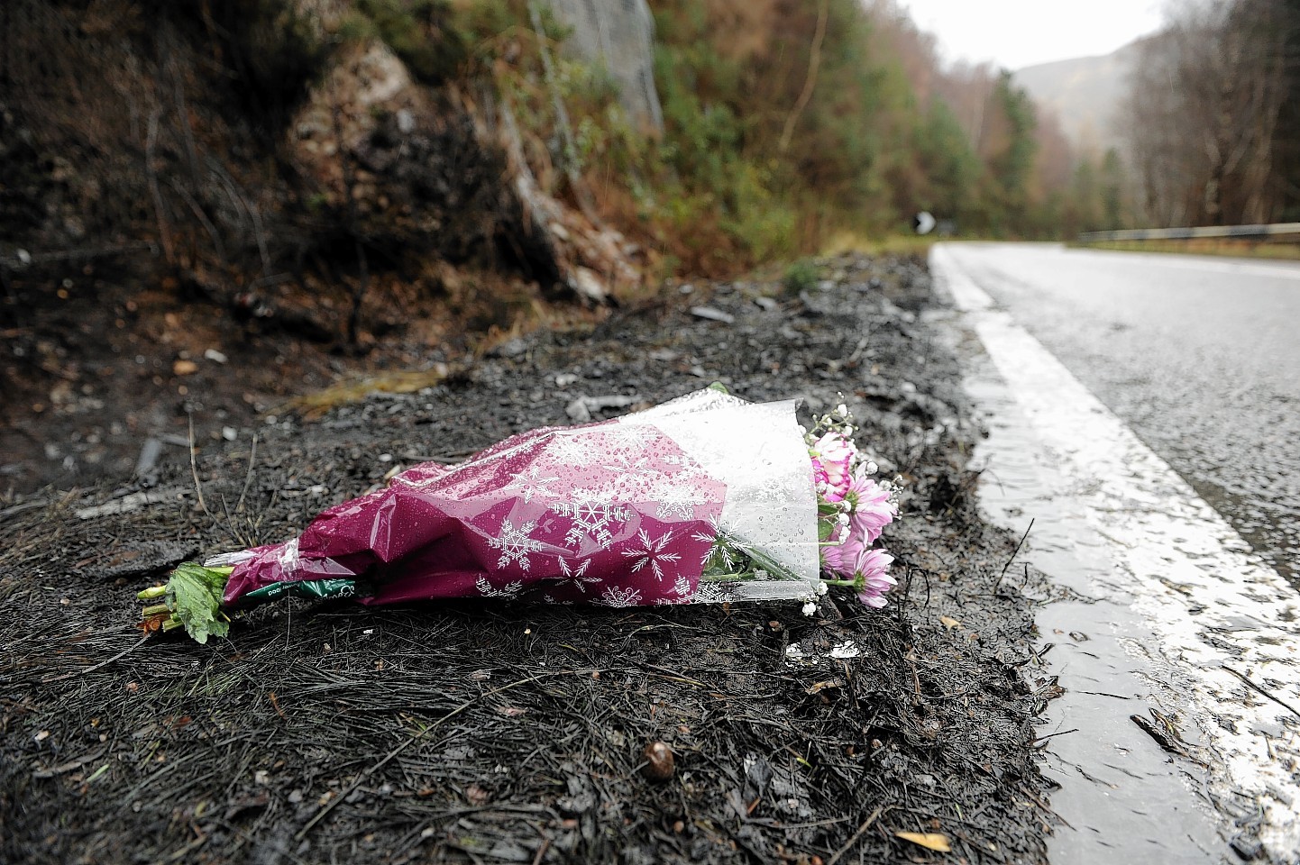 Flowers were laid yesterday at the site where the driver was killed.