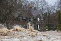 A house on the bank of the River Dee near Dinnet