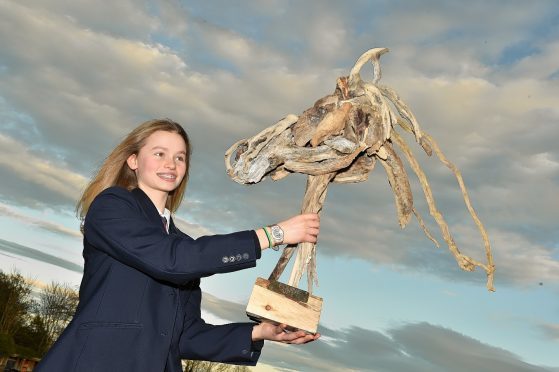 Millie Wark, 13, with her prize-winning sculpture