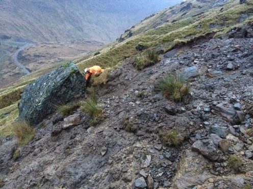 The boulder balancing over the A83