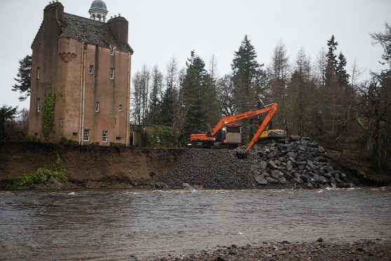 Boulders are placed by the castle in an effort to protect the historic building from the river