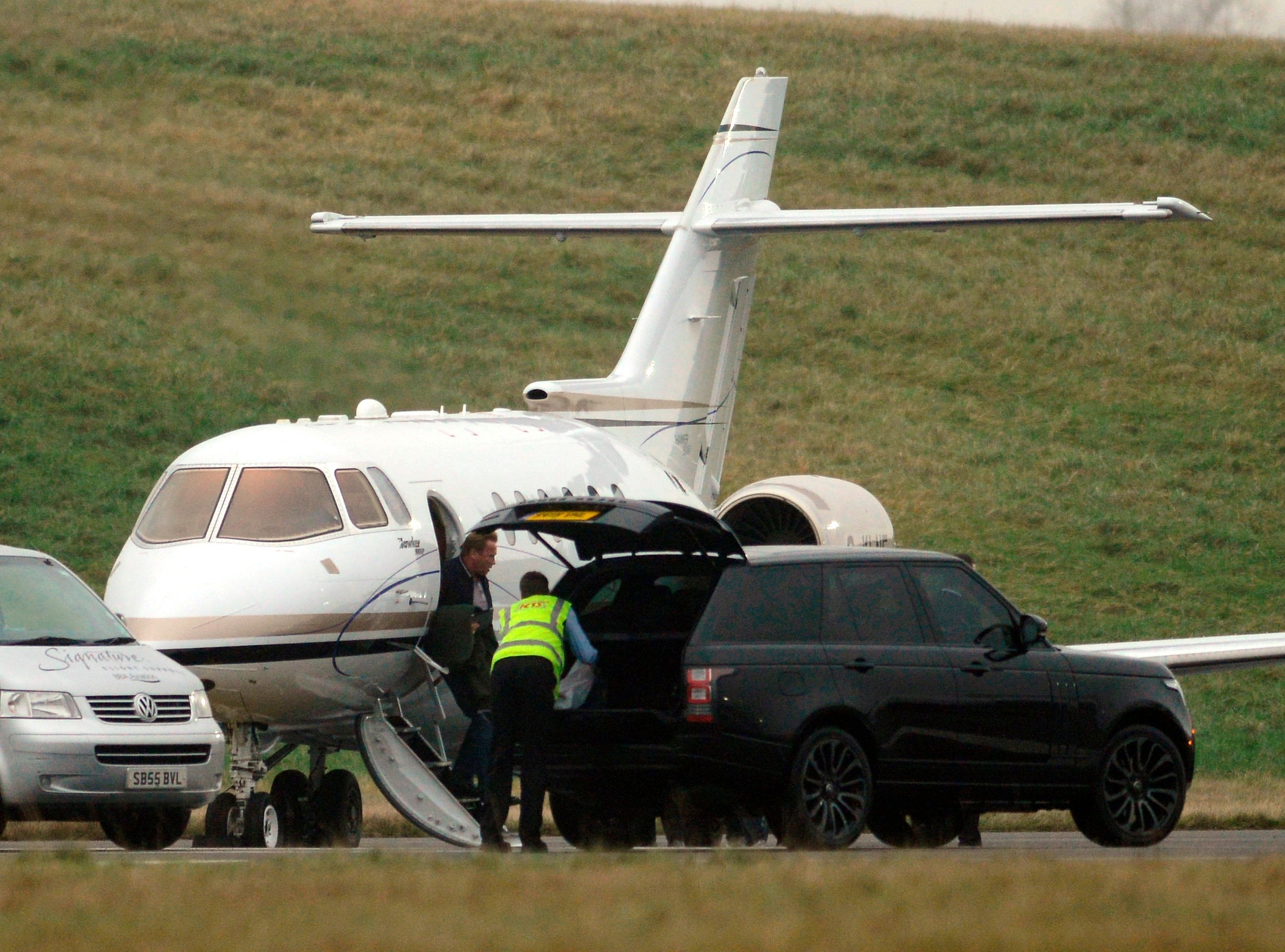 Arnold Schwarzenegger arrives at Edinburgh Airport on his private jet 