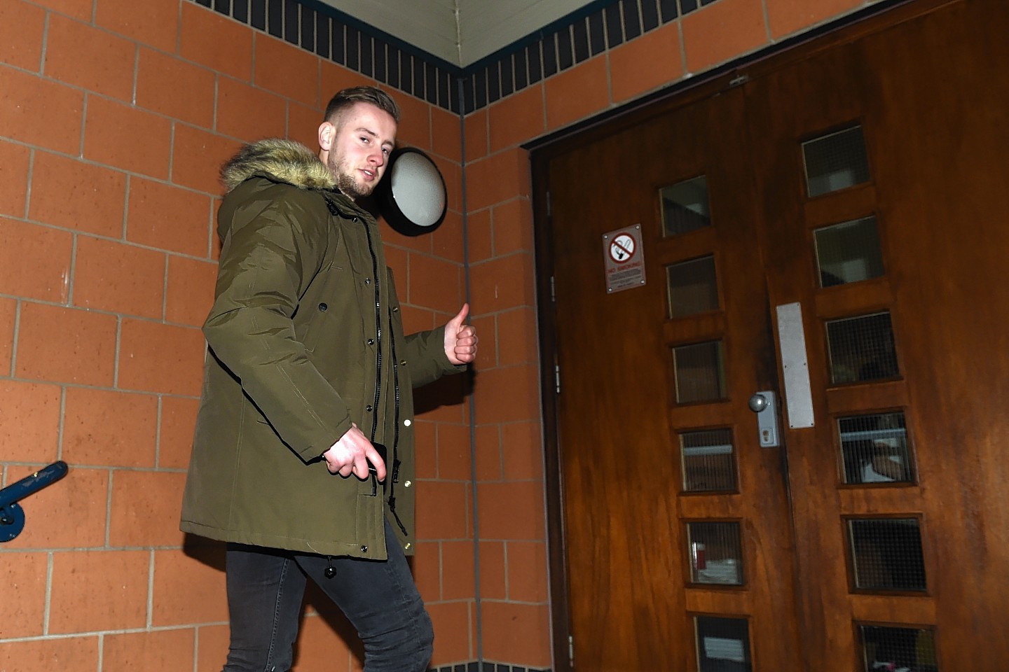 Billy King gives the cameras the thumbs up as he arrives at Murray Park to complete his move 