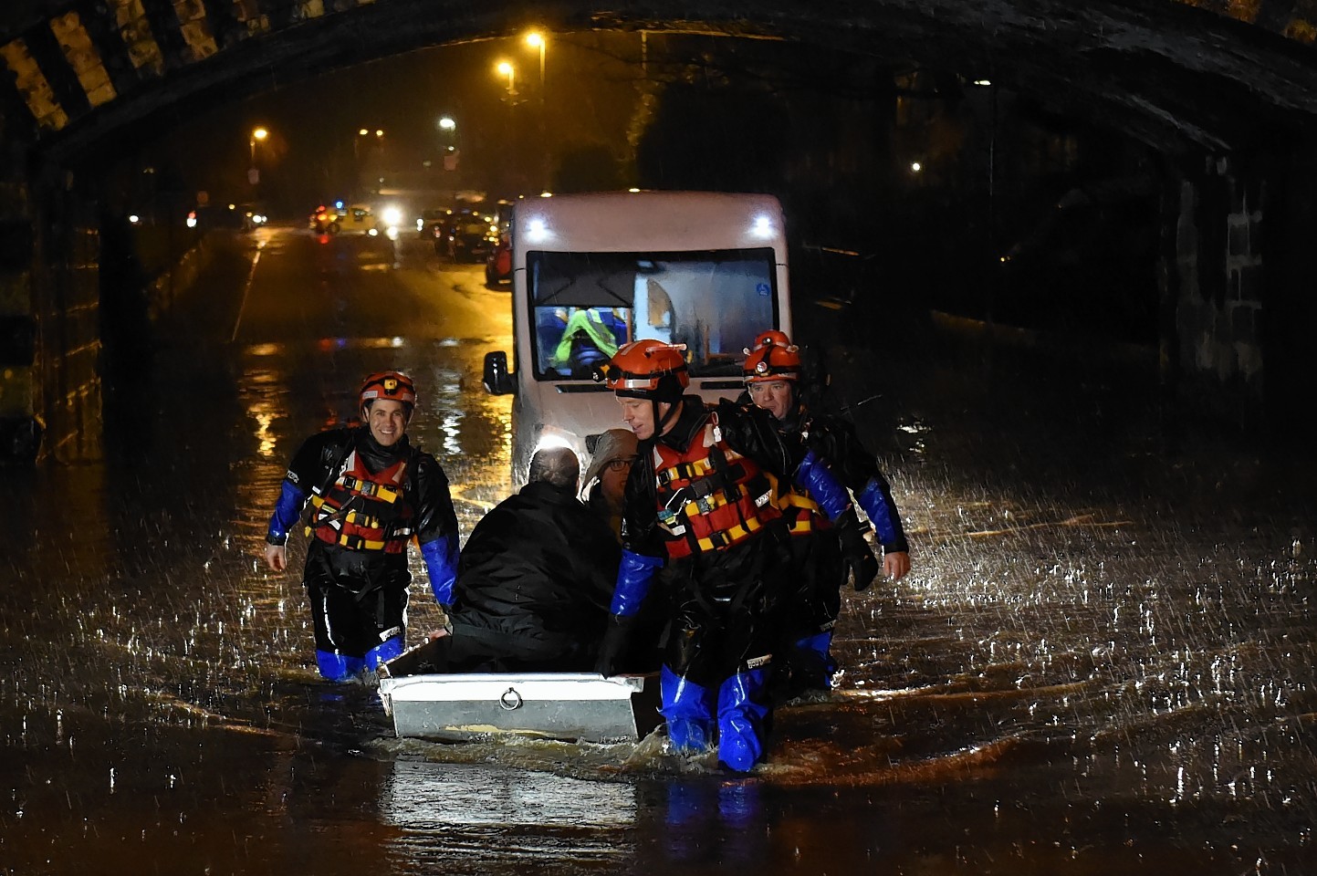 Fire crews rescue people from a bus left stranded in the floods earlier today on Stoneywood Road in Dyce. Picture by Kenny Elrick 