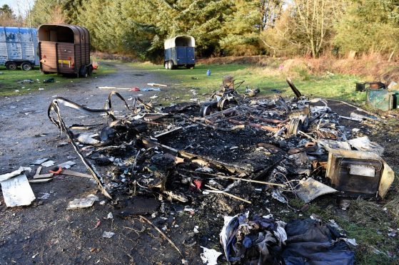 The burnt out remains of a caravan at Cottage Woods, Keith