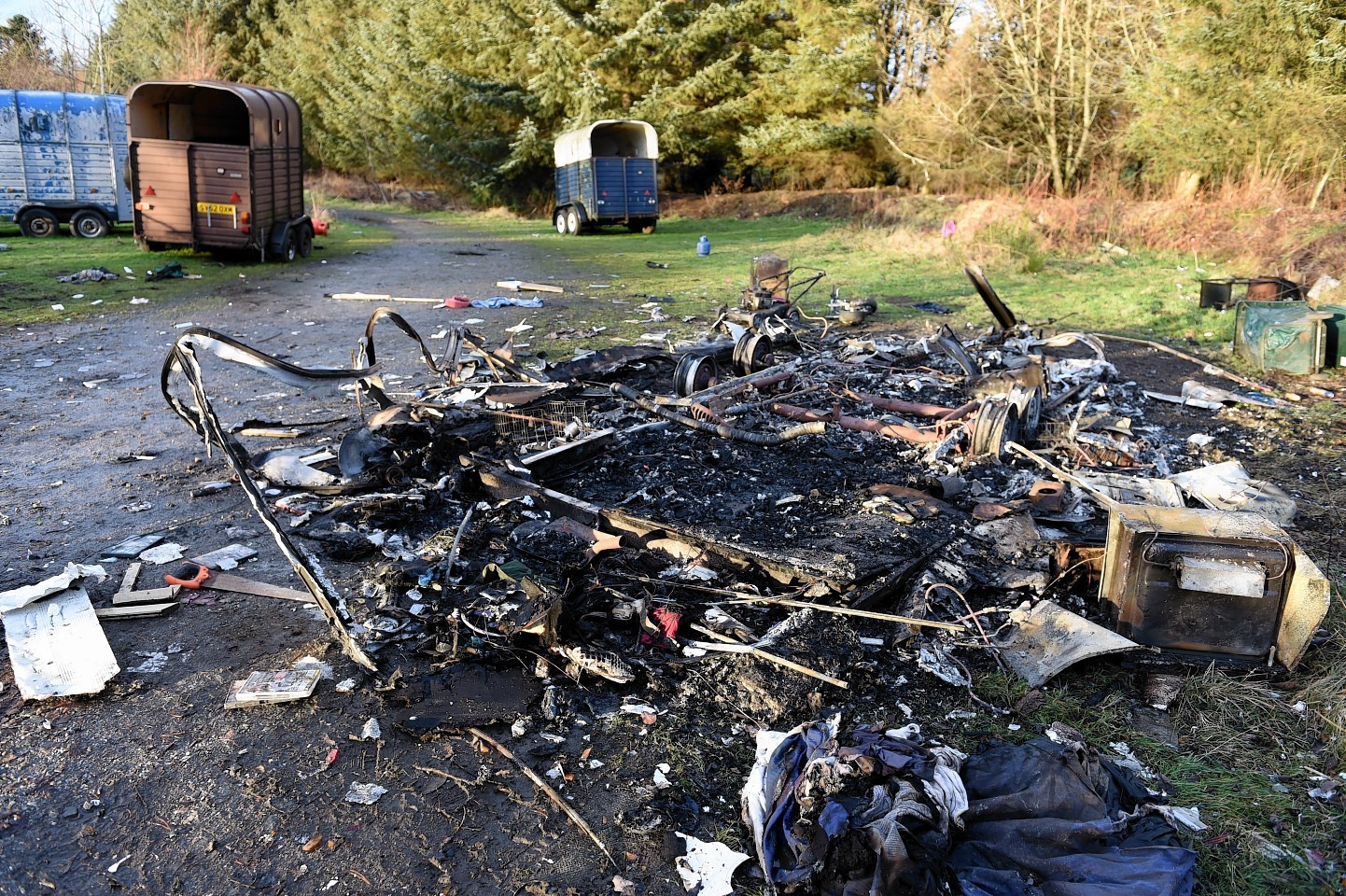 The burnt out remains of a caravan at Cottage Woods, Keith