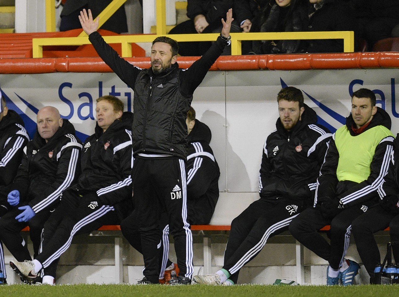 Aberdeen manager Derek McInnes encourages his players from the sidelines 