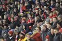 The Red Army take in the action at Pittodrie.