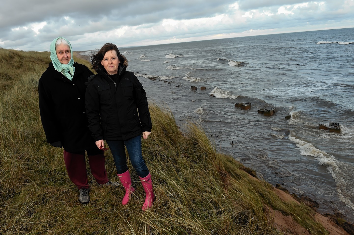 Edna Booth and Nicola Brown at the beach near the oil spill. Picture by Kenny Elrick 