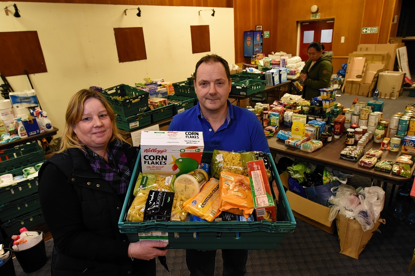 Fiona Conner and co-organiser George Petrie of the Flood Support group, have been collecting donations to give to flood victims at the British Legion, Inverurie. Picture by Kenny Elrick
