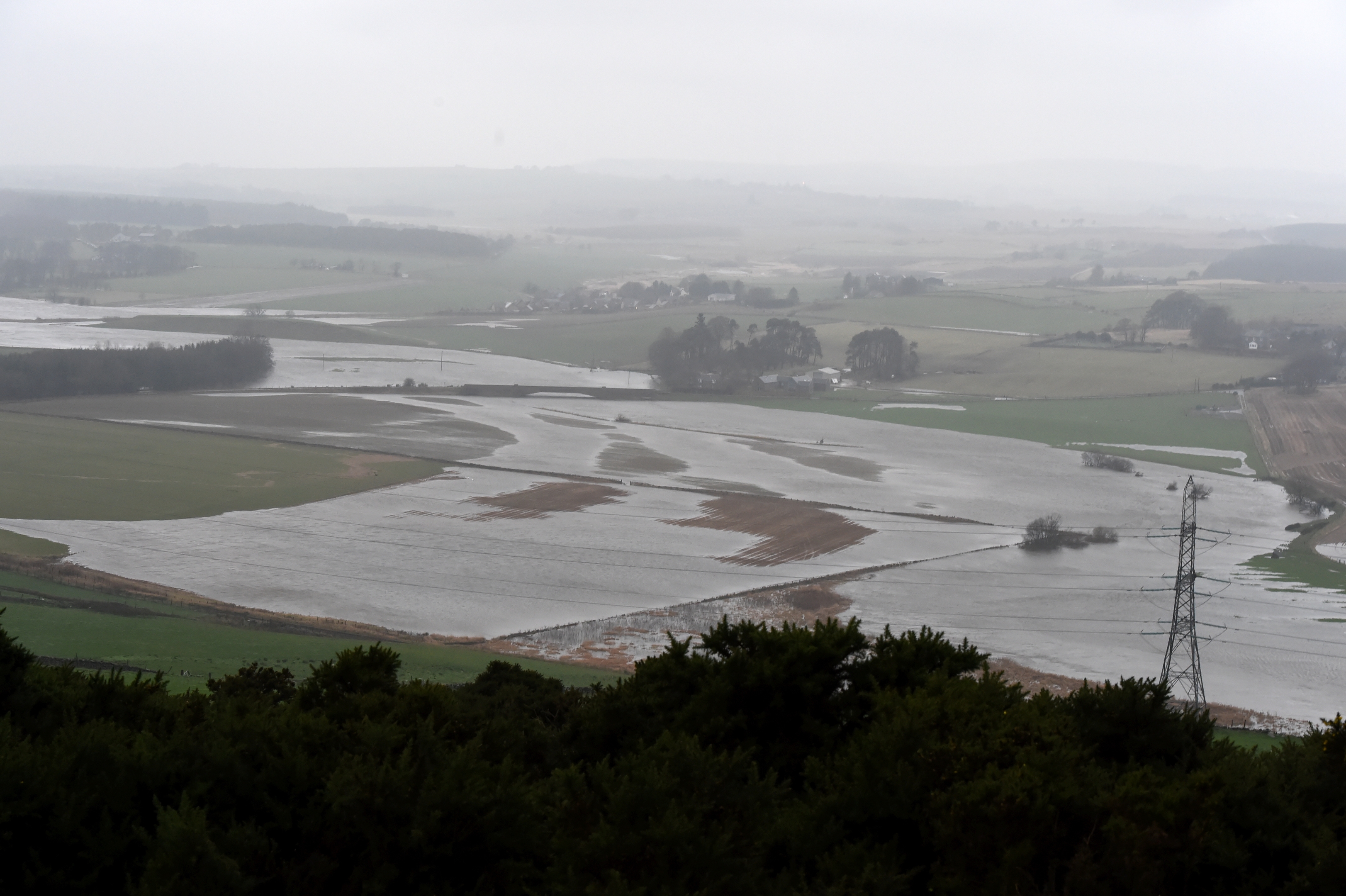 Flood-weary communities across north-east Scotland have been told to expect further heavy and prolonged rain. Picture of flooded fields near Hatton of Fintray. Pictures by KENNY ELRICK 