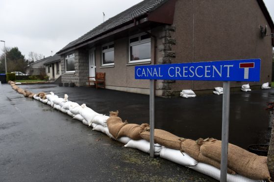 Residents with sand bags ready for flooding on Canal Crescent in Port Elphinstone, Inverurie.