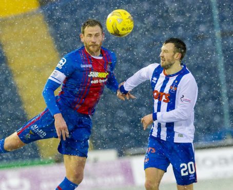 Caley Thistle defender Gary Warren and Kilmarnock's Dale Carrick in action