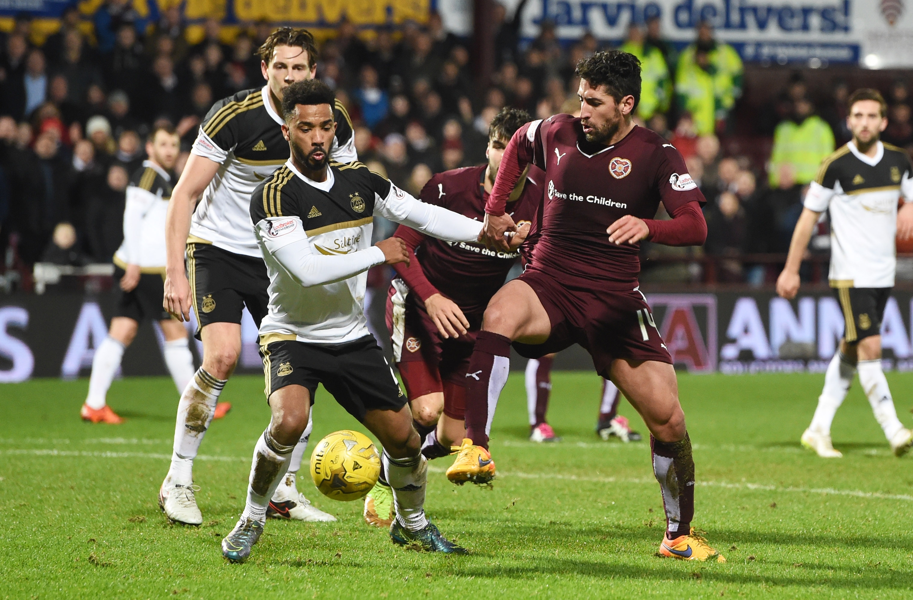 Aberdeen's Shay Logan (left) battles with Miguel Pallardo