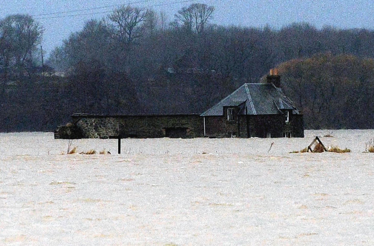 Heavy flooding near Couper Angus, Perth and Kinross, surrounds a cottage after the River Isla burst its banks 