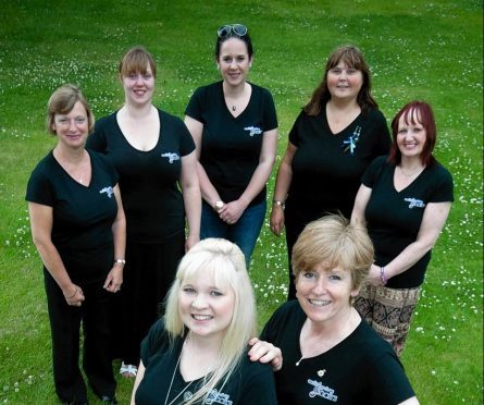 Kinloss Military Wives Choir members  Sheila Thompson, Christina Padbury, Laura Pettifar, Lorna Alexander and Julie McMillan.  At the front from the left Becca George and Felicity Sayers.