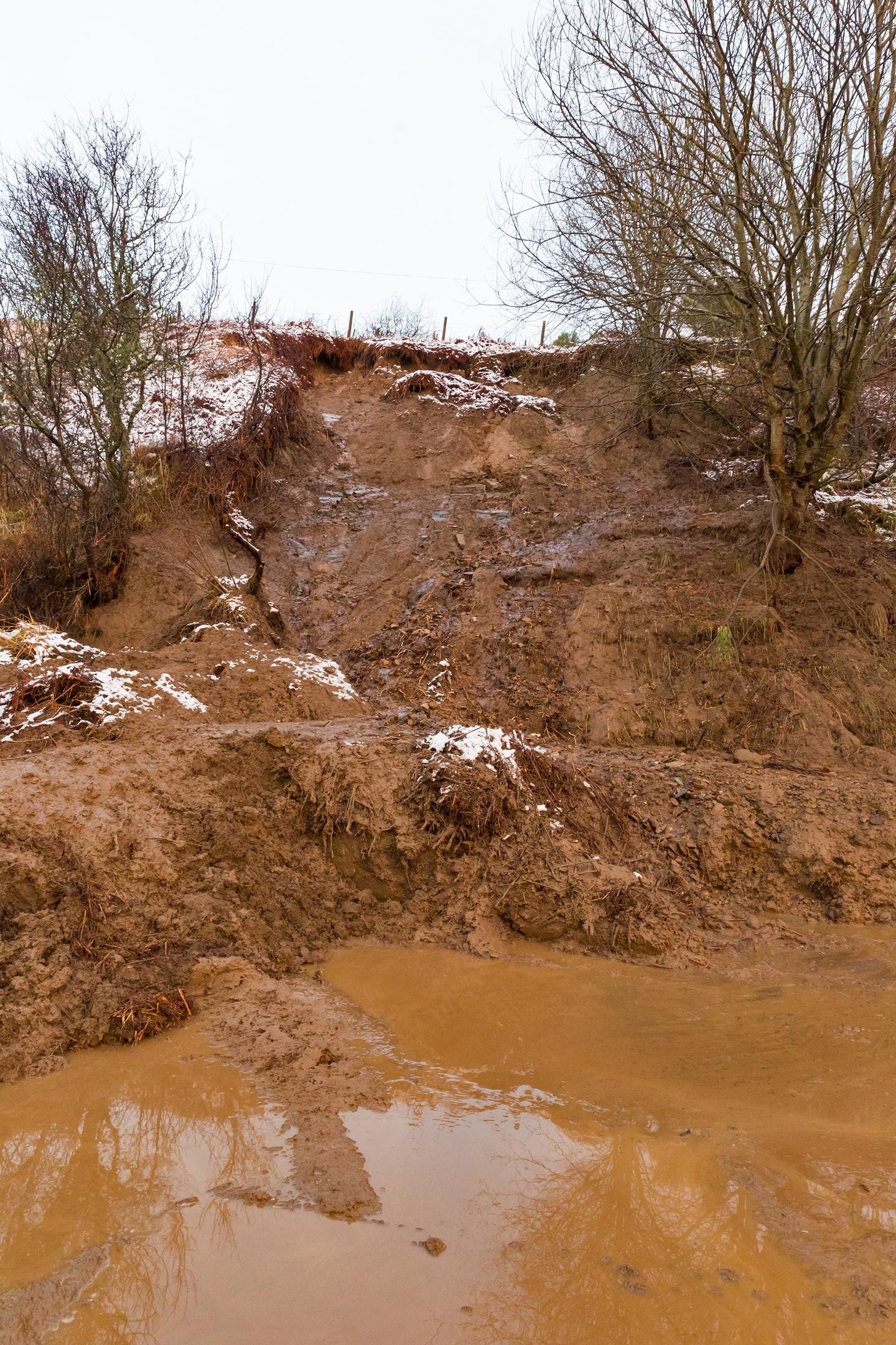 Hundreds of tonnes of mud block the road