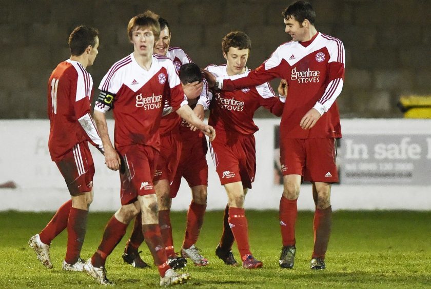 Lossiemouth celebrate their third goal, scored by Ross Archibald.
Picture by Gordon Lennox