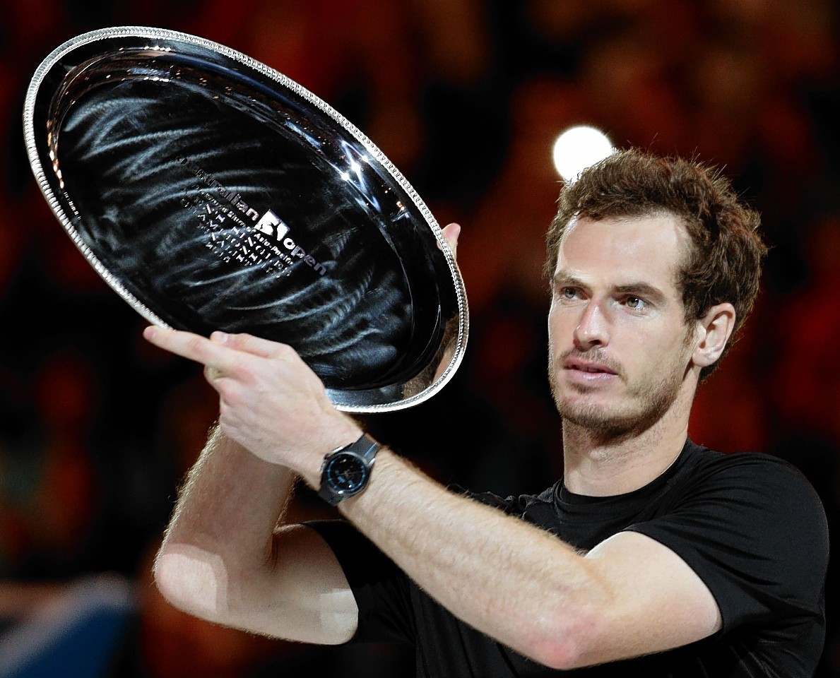 Murray holds aloft the runners-up trophy at last year's Australian Open 