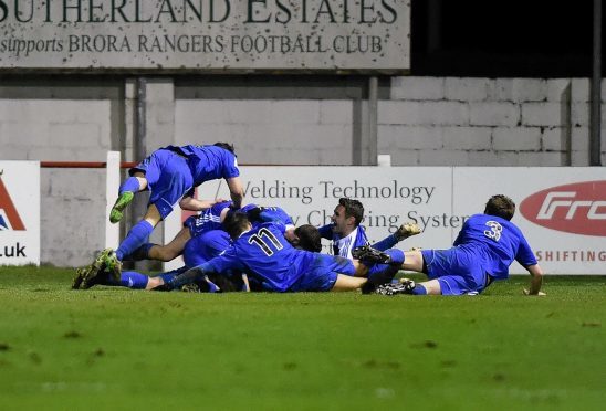 Nairn celebrate Robert Duncanson scoring the visitors' second goal.
Picture by Gordon Lennox